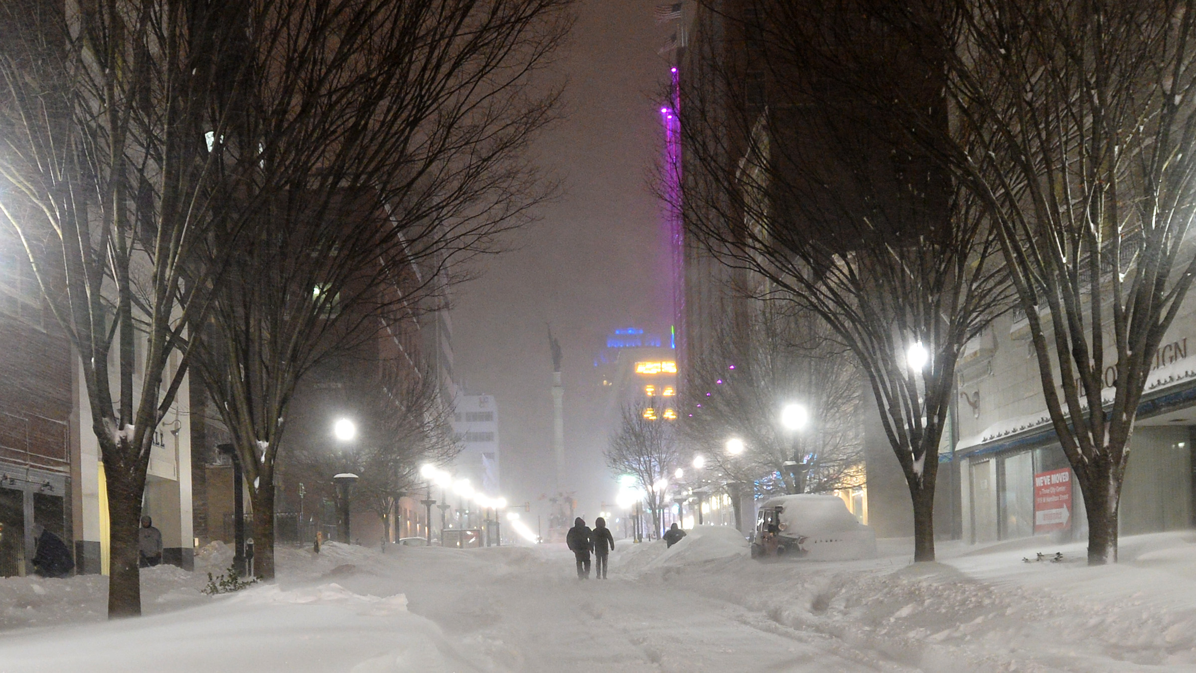On Hamilton Street in downtown Allentown, night falls and snow...