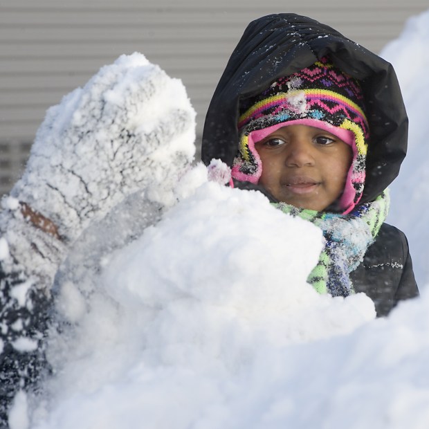 Khilynn Hartwell, 4, plays in the snow along Turner Street in Allentown as Lehigh Valley residents dug out from the Blizzard of 2016 on Sunday, Jan. 24, 2016. (Harry Fisher/The Morning Call)