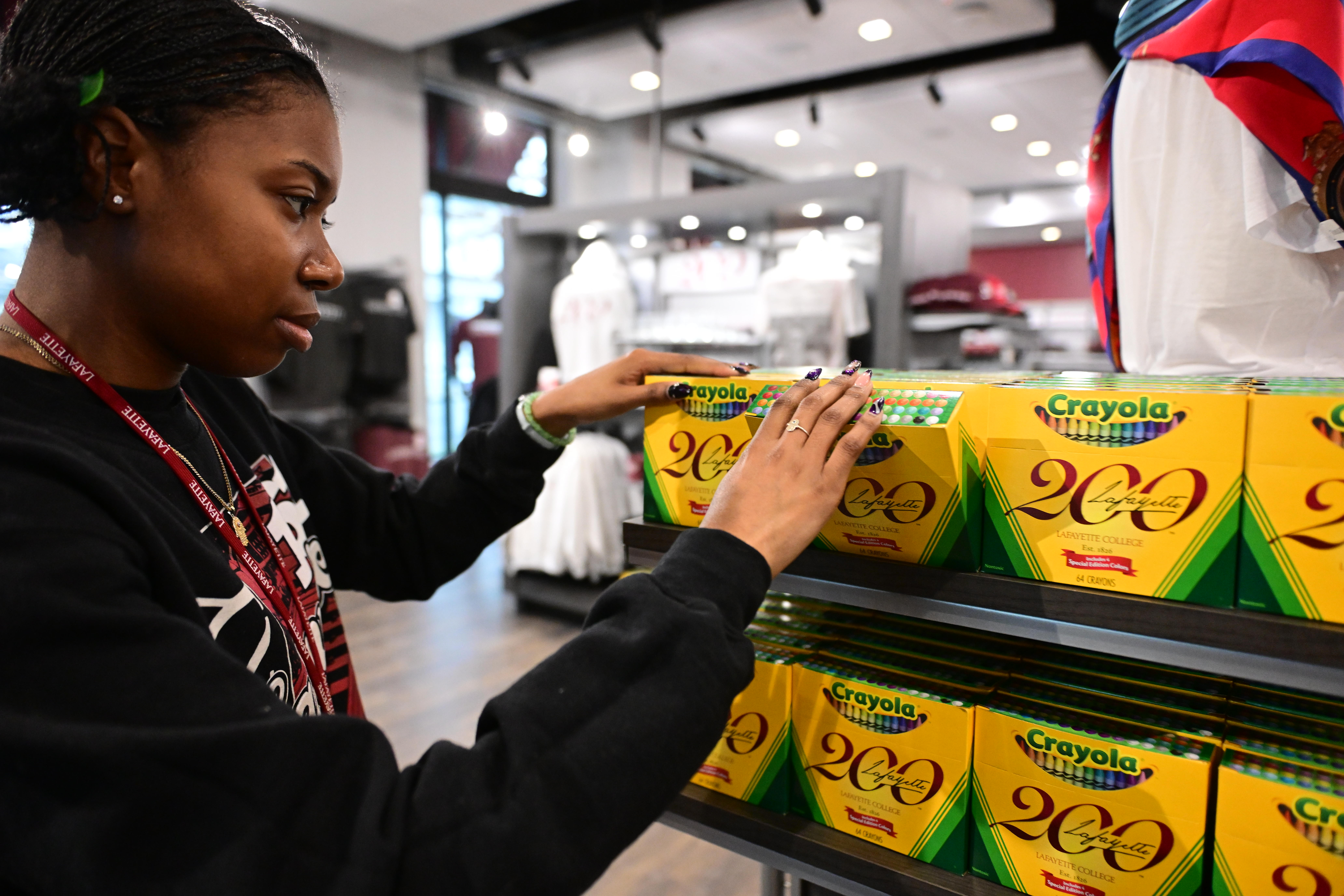 Jasmine Williams, a Lafayette College senior, arranges items Friday, Dec....