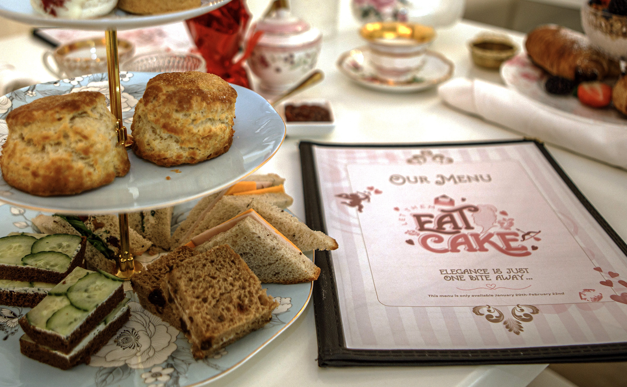 A Trio Tree Tower with three desserts, two scones and...