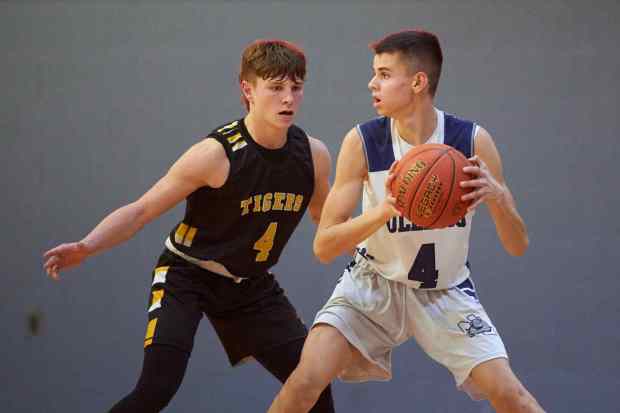 Northern Lehigh's Kellen Bauer with the ball defended by Northwestern Lehigh's Eli Zimmerman during a Colonial League boys basketball game in the 2023-24 season. Bauer scored 36 in a summer league game on Thursday night.