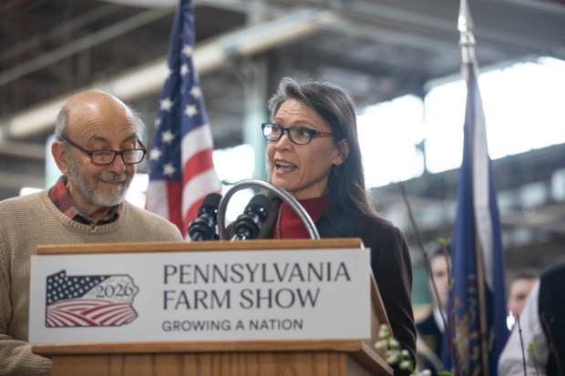Jim Victor and Marie Pelton, Butter Sculpture creators joined Agriculture Secretary Russell Redding on Thursday, Jan. 8, 2026, to unveil the 2026 Pennsylvania Farm Show Butter Sculpture, a 1,000-pound sculpture that illustrates how defining moments in U.S. history and the evolution of agriculture have grown side by side to shape our nation. This year's sculpture is titled, "A Toast to Our Nation's 250th Anniversary: Inspired by Founders. Grown by Farmers." Created for America's 250th anniversary, this year's butter sculpture honors Pennsylvania's pivotal role in the nation's founding and the growth of American agriculture and our nation's economy. Set in 1776 Philadelphia, the sculpture depicts Benjamin Franklin and the Founding Fathers at the signing of the Declaration of Independence, complete with a celebratory toast with milk. Patriotic elements, including the Liberty Bell, a tribute to Betsy Ross, and red, white, and blue accents underscore the spirit of the semi-quincentennial. At the same time, the base highlights Pennsylvania's enduring agricultural heritage. (Commonwealth Media Services)
