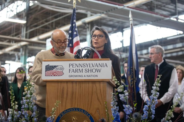 Jim Victor and Marie Pelton, Butter Sculpture creators joined Agriculture Secretary Russell Redding on Thursday, Jan. 8, 2026, to unveil the 2026 Pennsylvania Farm Show Butter Sculpture, a 1,000-pound sculpture that illustrates how defining moments in U.S. history and the evolution of agriculture have grown side by side to shape our nation. This year's sculpture is titled, "A Toast to Our Nation's 250th Anniversary: Inspired by Founders. Grown by Farmers." Created for America's 250th anniversary, this year's butter sculpture honors Pennsylvania's pivotal role in the nation's founding and the growth of American agriculture and our nation's economy. Set in 1776 Philadelphia, the sculpture depicts Benjamin Franklin and the Founding Fathers at the signing of the Declaration of Independence, complete with a celebratory toast with milk. Patriotic elements, including the Liberty Bell, a tribute to Betsy Ross, and red, white, and blue accents underscore the spirit of the semi-quincentennial. At the same time, the base highlights Pennsylvania's enduring agricultural heritage. (Commonwealth Media Services)