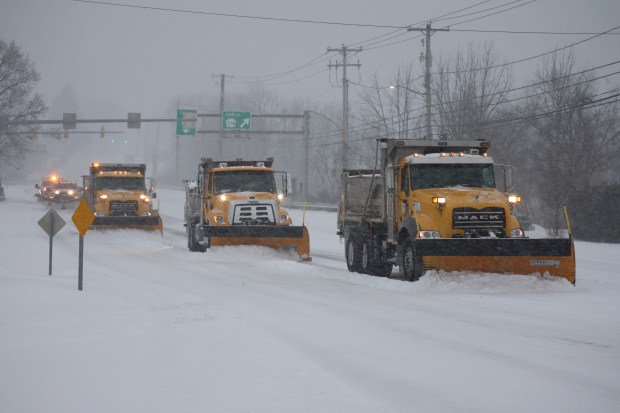 A caravan of snowplows clears the road Sunday, Jan. 25, 2026, on Eighth Avenue in Bethlehem as a major snowstorm moved into the area. (Rich Rolen/Special to The Morning Call)