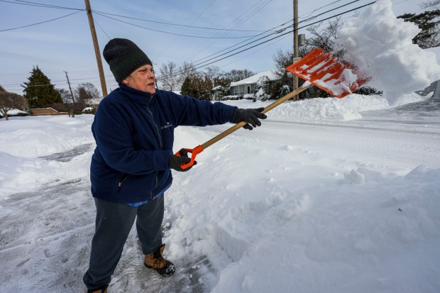 Donna Schuman of Bethlehem tries to shovel out her driveway Monday, Jan. 26, 2026, in Bethlehem after Sunday's storm that dropped more than a foot of snow in some parts of the Lehigh Valley. She said she shoveled yesterday as well to try and keep up with the storm. (April Gamiz/The Morning Call)