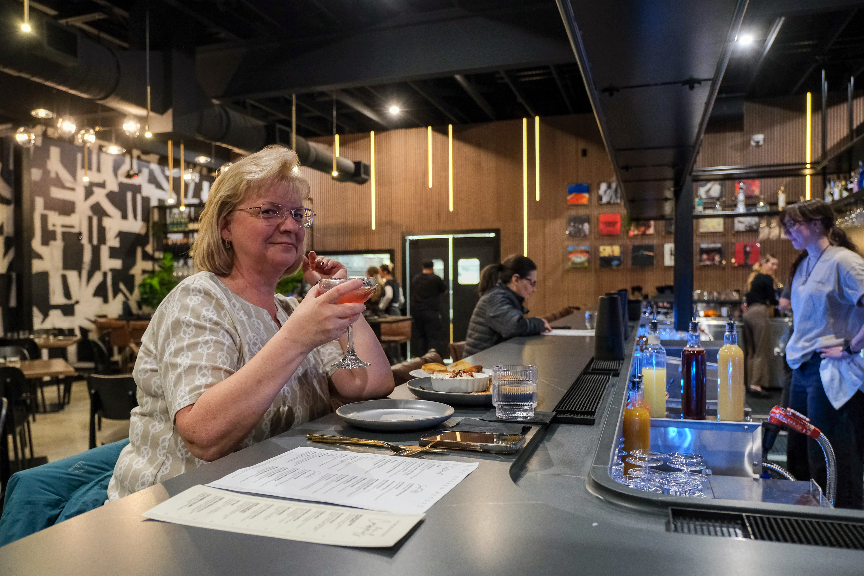 Cherri Scholz of Emmaus enjoys dinner and a martini at...