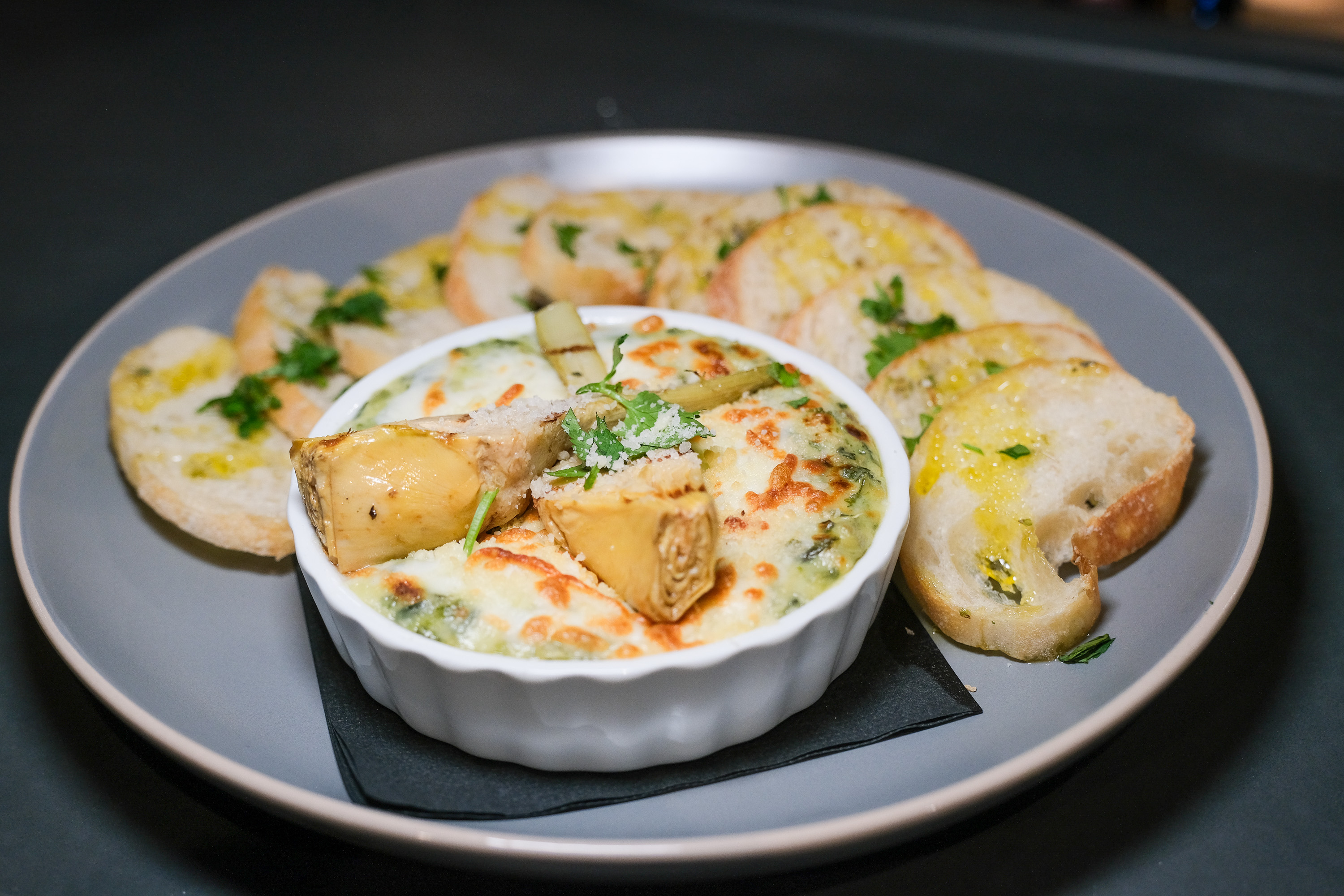 Spinach artichoke dip is one of the small plates served...