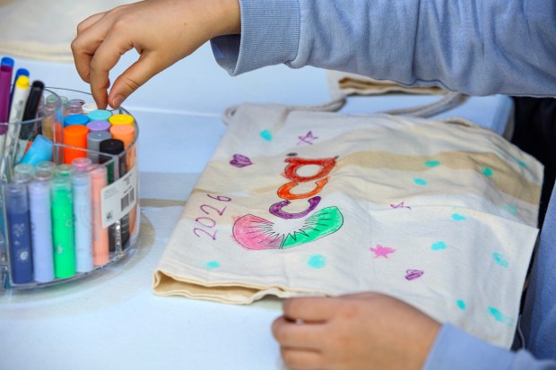 Giana Jimenez, 9, of Bethlehem designs a canvas bag during the 14th annual Three Kings Celebration on Sunday, Jan. 4, 2026, at SteelStacks in Bethlehem. (Jane Therese/Special to The Morning Call)