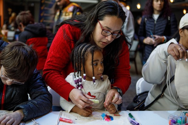 Keila Brown of Bensalem helps her daughter, LaSandra Brown, 3, design a canvas bag during the 14th annual Three Kings Celebration on Sunday, Jan. 4, 2026, at SteelStacks in Bethlehem. (Jane Therese/Special to The Morning Call)