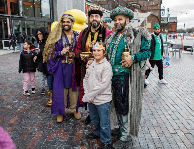 Kristopher Colon, 8, of Fayetteville, N.C., has his picture taken with the Three Kings, Ramon Rodriguez, Hector Vazquez and William Cintron, during the 14th annual Three Kings Celebration on Sunday, Jan. 4, 2026, at SteelStacks in Bethlehem. (Jane Therese/Special to The Morning Call)