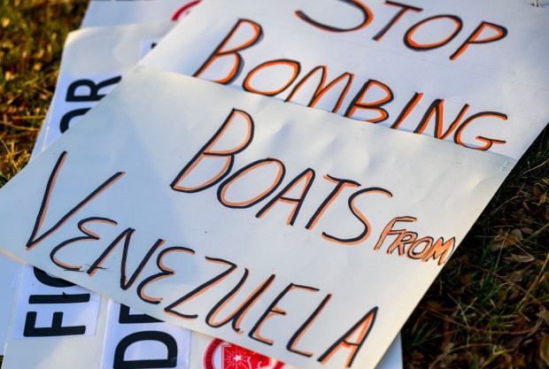 Posters are available to be held Thursday, Jan. 8, 2026, in Bethlehem. Organizers with the Lehigh Valley Democratic Socialists of America and LEPOCO Peace Center protest for causes including against the recent U.S. military action in Venezuela. (April Gamiz/The Morning Call)