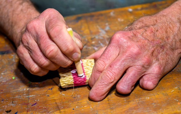 Dave Jacoby of Bethlehem Township paints experimental art on tiles Tuesday, Jan. 6, 2026, in Bethlehem Township. As part of an idea he had years ago that he calls WOA! (World of art!), Jacoby leaves the tiles in various place to cheer up people at a time when there is fear, anger and sadness in the world. He started a Facebook page and gives the tiles to people, asking them to spread the art and upload a photo and a post about where it was placed. (April Gamiz / The Morning Call)