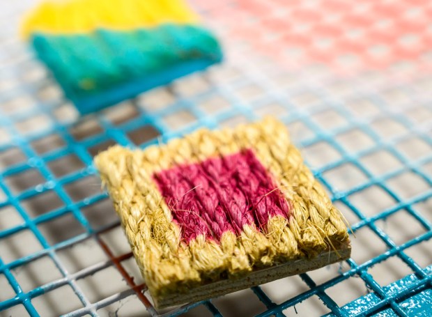 Experimental art tiles Tuesday, Jan. 6, 2026, created by Dave Jacoby of Bethlehem Township as part of an idea he had years ago that he calls WOA! (World of art!). Jacoby leaves the tiles in various place to cheer up people at a time when there is fear, anger and sadness in the world. He started a Facebook page and gives the tiles to people, asking them to spread the art and upload a photo and a post about where it was placed. (April Gamiz / The Morning Call)