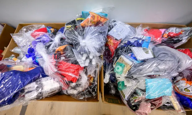 Around 120 essential supply kits containing water, hand warmers, a comb, gloves and other items are boxed and ready to be delivered Sunday, Jan. 11, 2026, at Baitul Ata Mosque in Salisbury Township. Members of the Ahmadiyya Muslim Community's Lehigh Valley chapter will distribute the kits directly to individuals experiencing homelessness. The effort is part of the community's ongoing commitment to its guiding principle, "Love for All, Hatred for None," which includes regular blood drives, food drives and programs to feed the hungry throughout the year. (April Gamiz/The Morning Call)