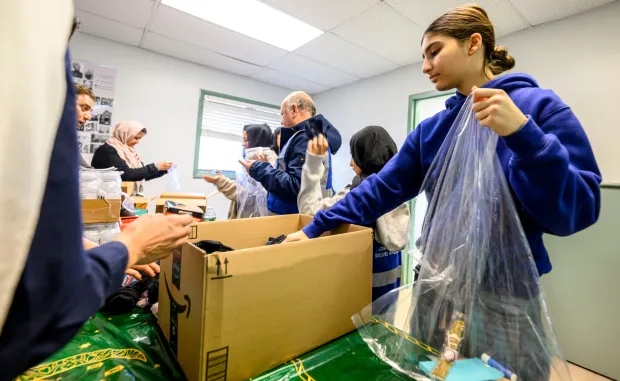 Noor Chaudhry and other members of the Ahmadiyya Muslim Community's Lehigh Valley chapter gather to pack essential supply kits for individuals experiencing homelessness Sunday, Jan. 11, 2026, at Baitul Ata Mosque in Salisbury Township. The effort is part of the community's ongoing commitment to its guiding principle, "Love for All, Hatred for None," which includes regular blood drives, food drives and programs to feed the hungry throughout the year. (April Gamiz/The Morning Call)