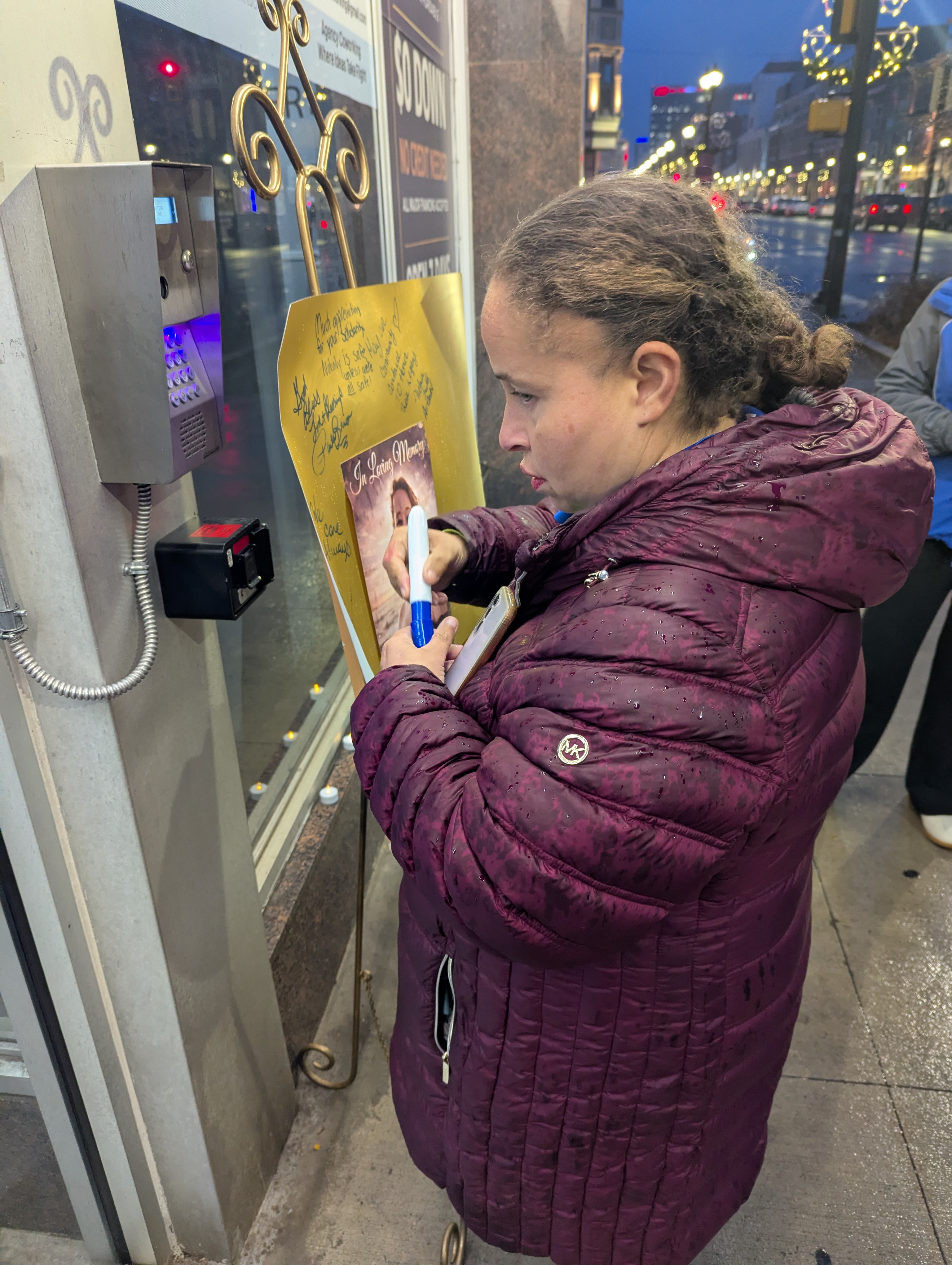 Allentown City Councilmember Ce-Ce Gerlach signs a tribute poster for...