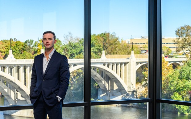 Jaindl Enterprises COO Zachary Jaindl talks Monday, Oct. 23, 2023, about the expansive views of the Lehigh riverfront from the new 615 Waterfront Drive office building, the first building to open in Jaindl's Waterfront development in Allentown. (April Gamiz/The Morning Call)