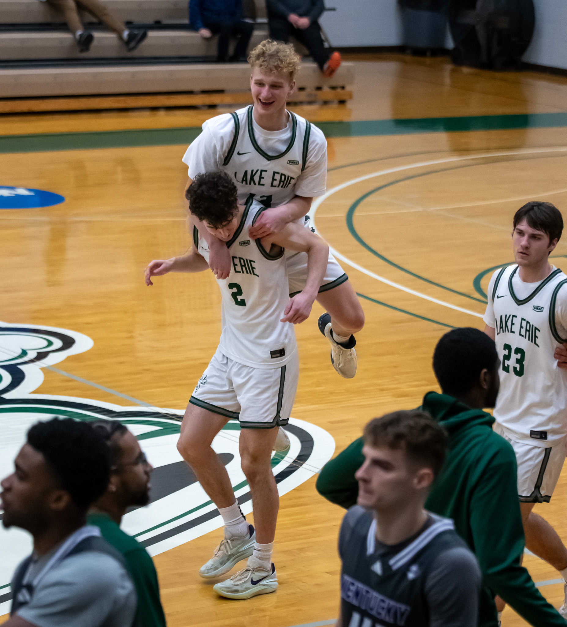 Lake Erie players celebrate their 82-77 win over Kentucky Wesleyan...