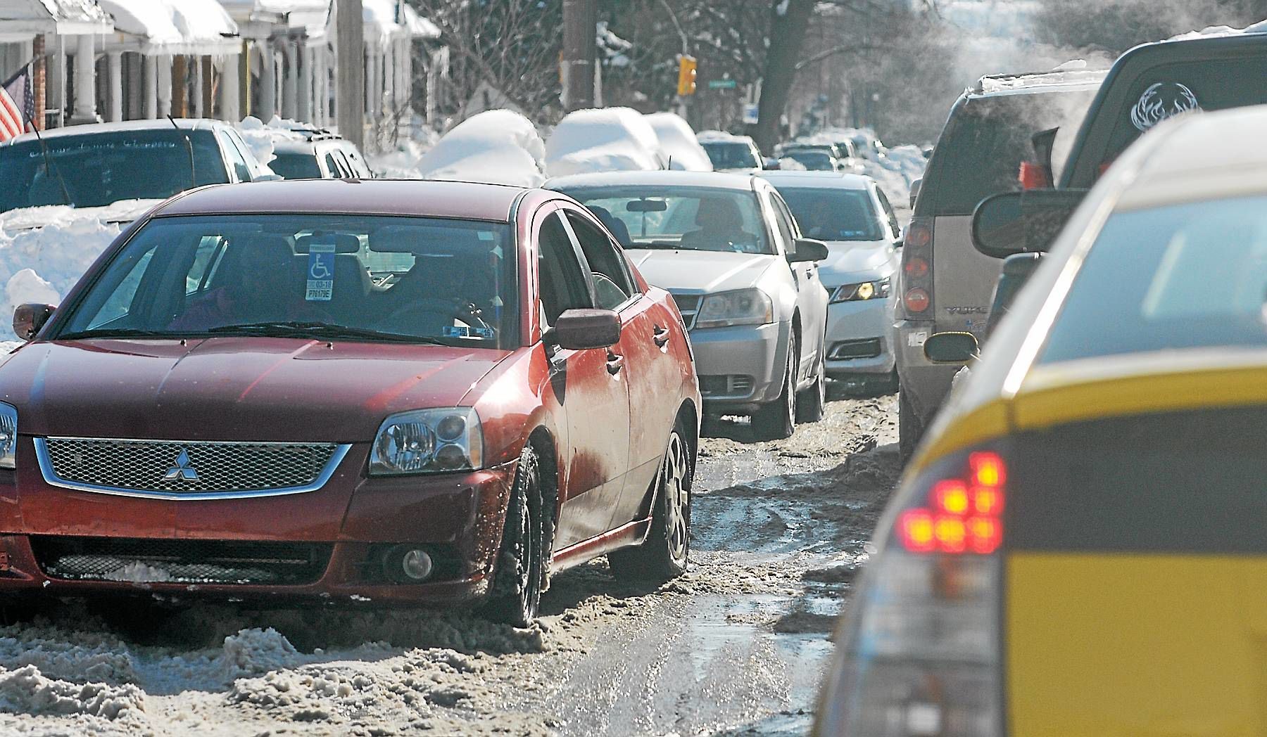Drivers share a single lane along West Marshall Street in...