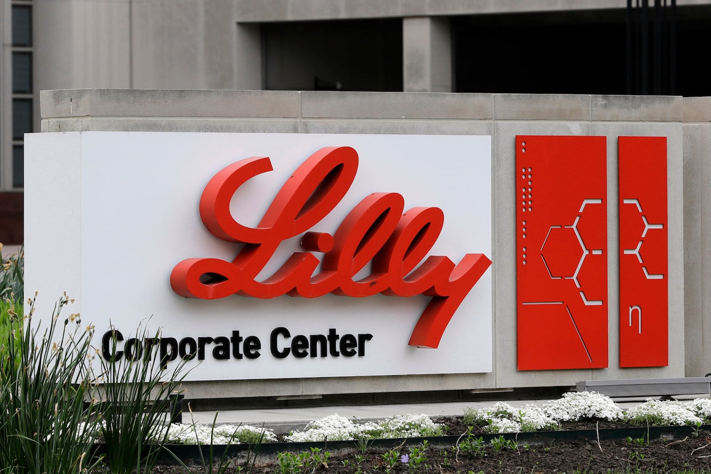 A sign for Eli Lilly & Co. stands outside their corporate headquarters in Indianapolis on April 26, 2017.