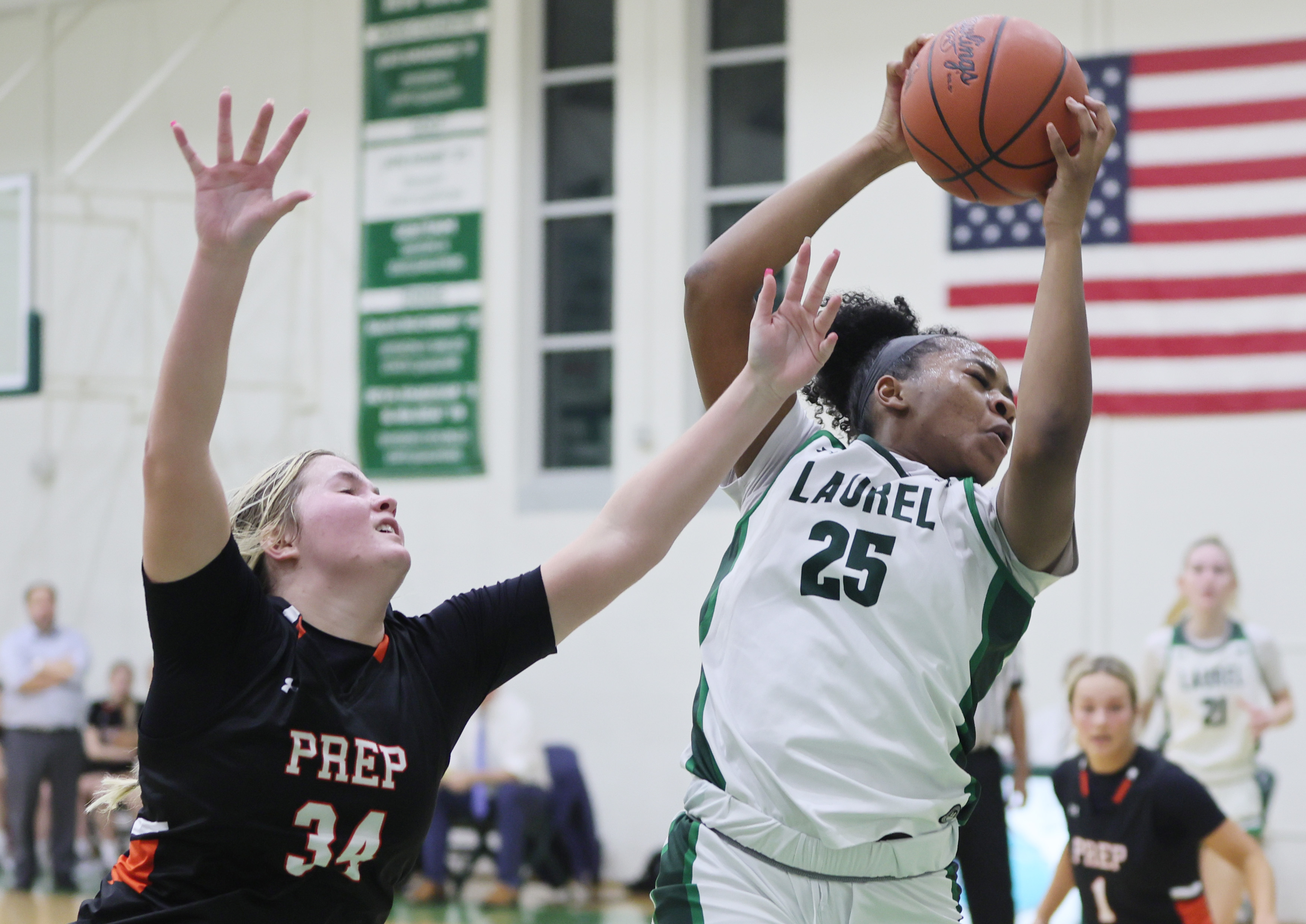 Laurel's Sydnee Robinson secures a rebound from Cathedral Prep's Mady Brzezinski in the second half. 