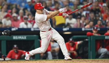 Aug 17, 2024; Philadelphia, Pennsylvania, USA; Philadelphia Phillies catcher J.T. Realmuto (10) hits an RBI single against the Washington Nationals in the sixth inning at Citizens Bank Park.