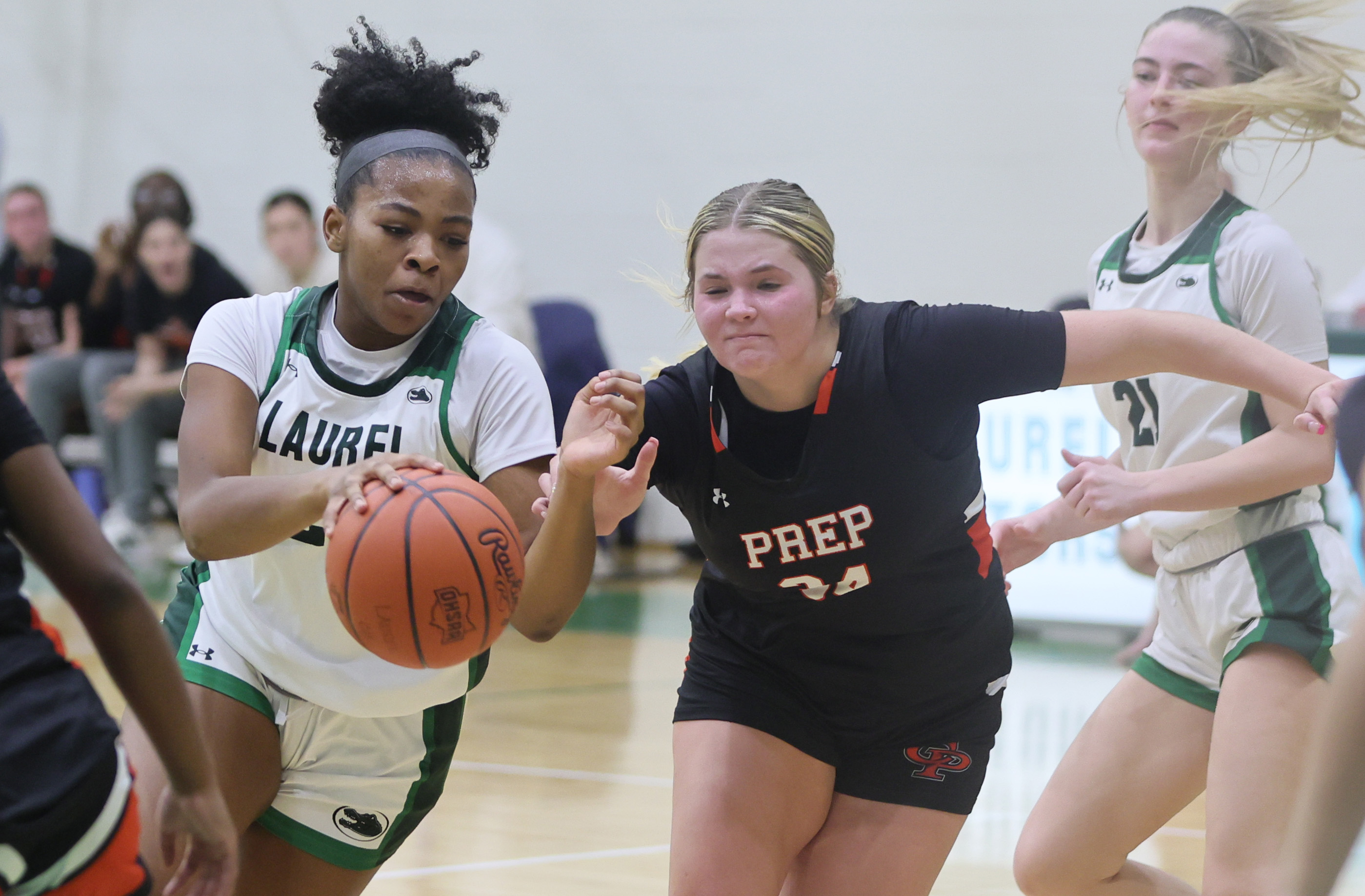 Laurel's Sydnee Robinson drives to the basket guarded by Cathedral Prep's Mady Brzezinski in the second half. 