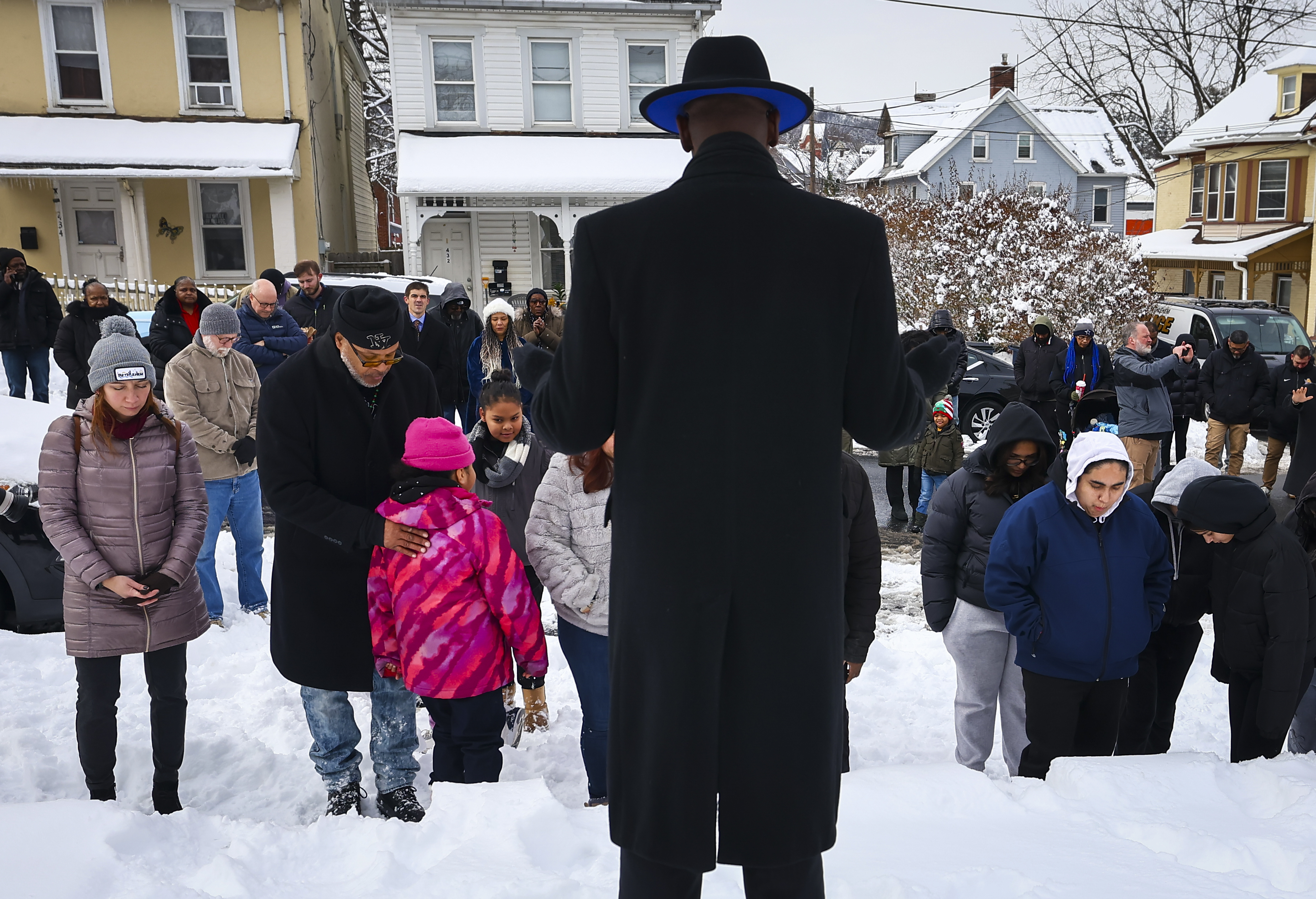 Timothy Smith, minister at New Christian Harvard Church in Allentown leads everyone in prayer at Martin Luther King Park following a Civil Rights Movement March honoring Dr. Martin Luther King Jr. on Monday, Jan. 19, 2025, through Southside Bethlehem. 