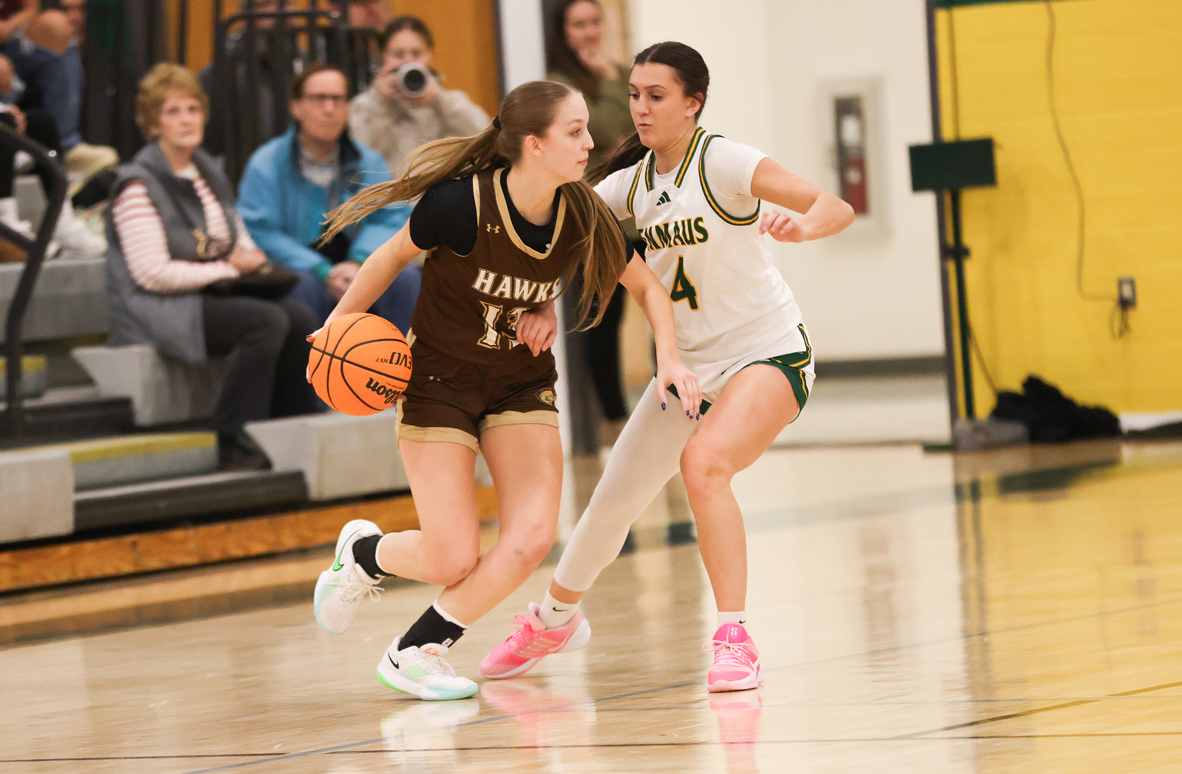 Bethlehem Catholic’s Kendall Nickischer (13) tries to dribble the ball past Emmaus player Gabby DeVita (4) during a game at Emmaus on Jan. 12, 2026.
