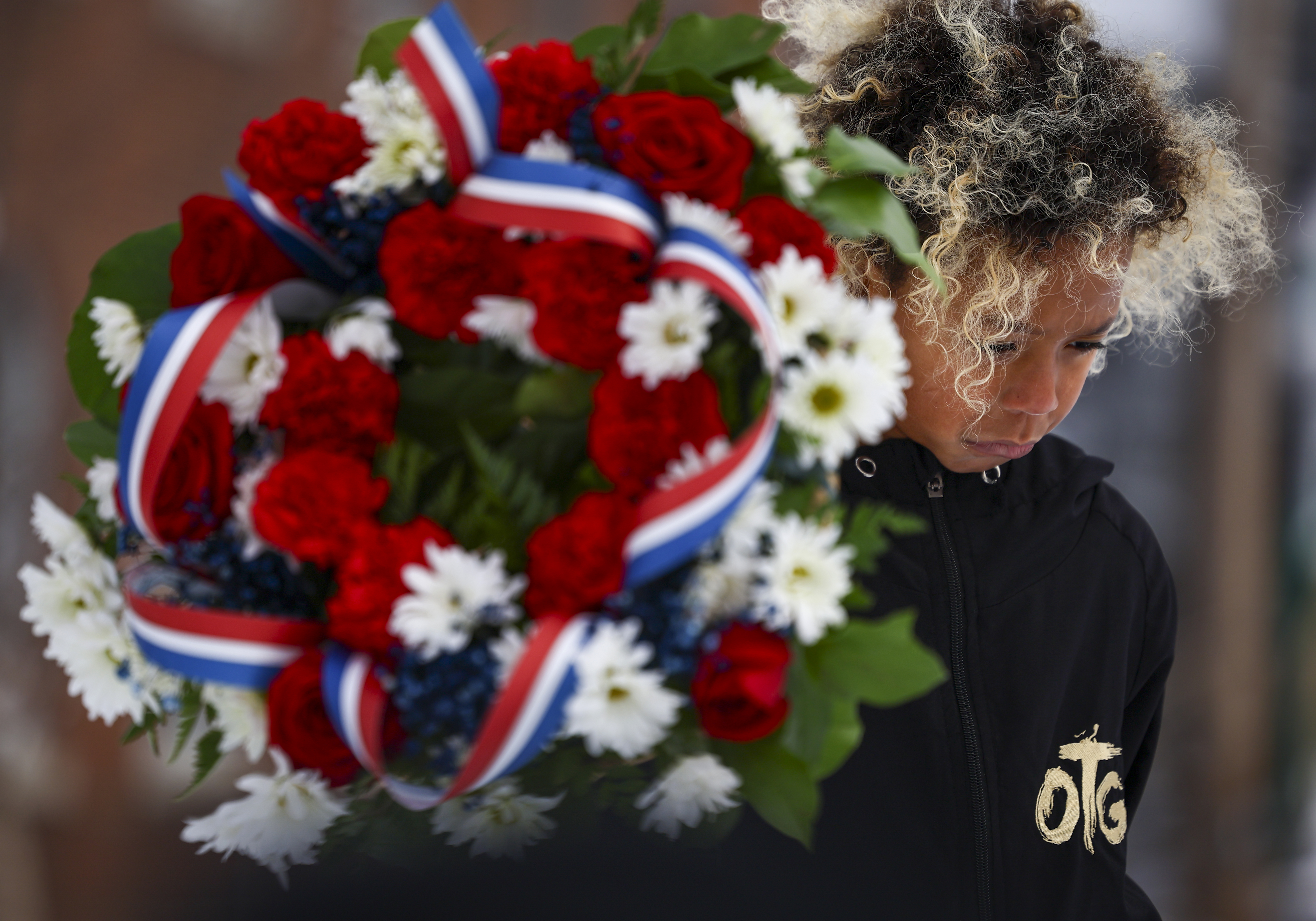 Marcello King, 9, of Bethlehem, bow his head in a moment of silence at Martin Luther King Park following, the Civil Rights Movement March honoring Dr. Martin Luther King Jr. on Monday, Jan. 19, 2025, through Southside Bethlehem. 