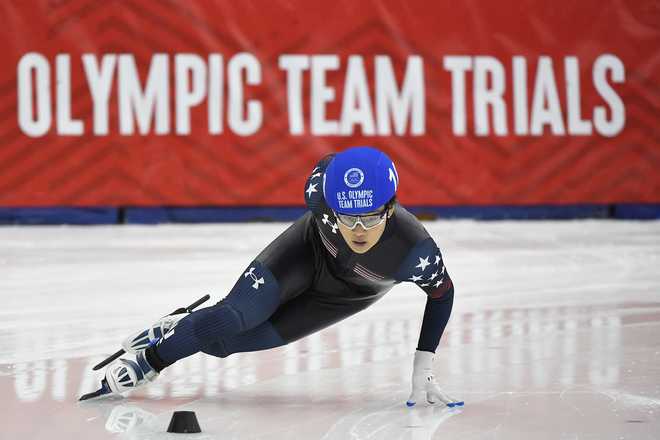 KEARNS, UTAH - DECEMBER 19: Andrew Heo leads a Men's 1000 meter semifinal on Day 3 of the US Short Track Speed Skating Olympic Trials at Utah Olympic Oval on December 19, 2021 in Kearns, Utah. (Photo by Alex Goodlett/Getty Images)