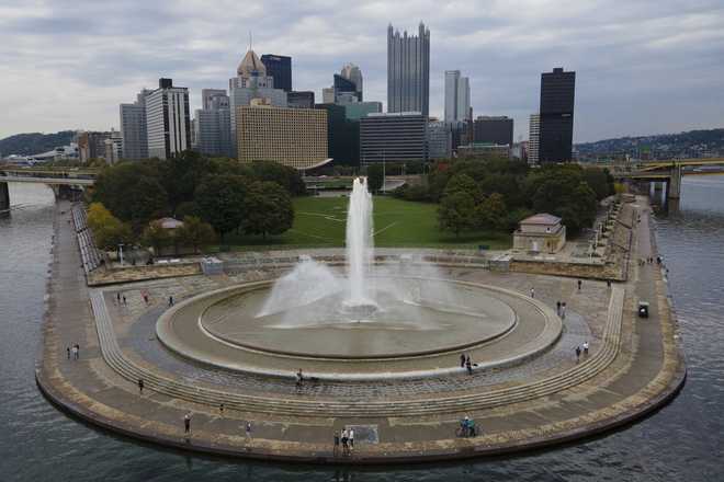The Point State Park Fountain is part of the downtown skyline in Pittsburgh, Pennsylvania, on Saturday, October 12, 2024. (AP Photo/Ted Shaffrey)
