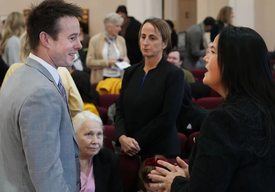 Erie County Chief Deputy District Attorney Jeremy Lightner, left, talks with Emily Mosco Merski, right, at the Erie County Courthouse prior to Merski's swearing-in as Erie County Common Pleas Court judge on Jan. 5. Merski defeated Lightner in the judicial race in November.