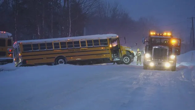 A school bus is pulled out of a ditch near Erie, Pennsylvania Thursday. (Live Storms Media)