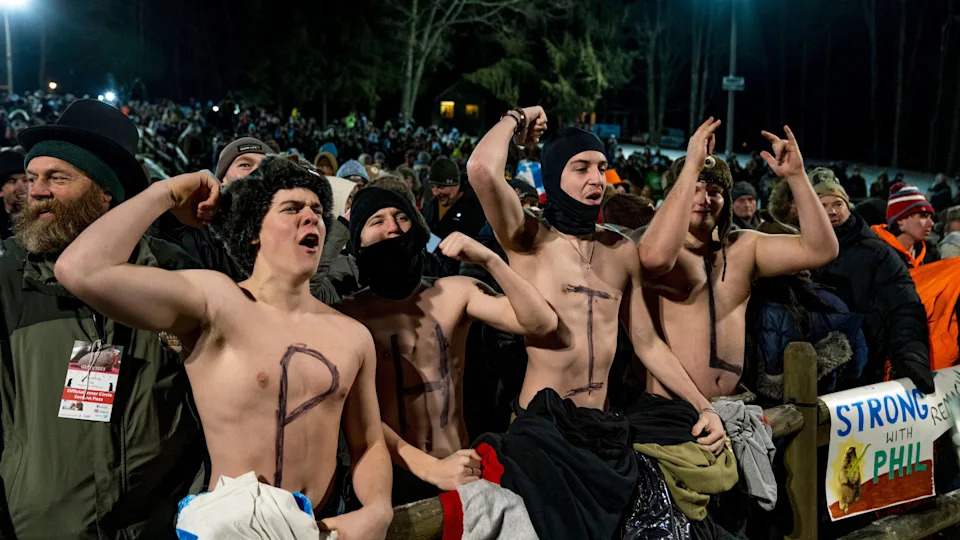Landon Cook, Aiden Cameron, Sawyer Hall and Matt Grusky cheer during a concert on February 2, 2023 in Punxsutawney, Pennsylvania. Thousands of people spent a night of revelry awaiting the sunrise and the groundhog's exit from his winter den. 