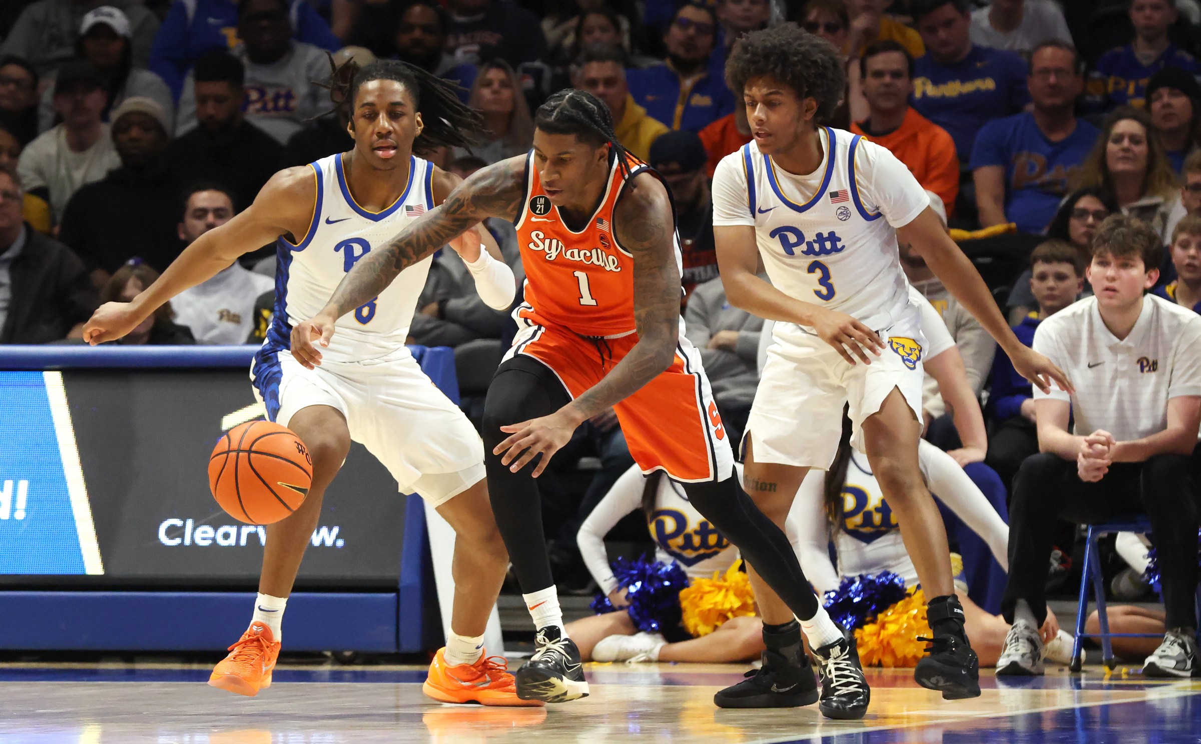 Jan 10, 2026; Pittsburgh, Pennsylvania, USA; Syracuse Orange forward Donnie Freeman (1) grabs a loose ball ahead of Pittsburgh Panthers guard Omari Witherspoon (8) and guard Brandin Cummings (3) during the second half at the Petersen Events Center. Mandatory Credit: Charles LeClaire-Imagn Images