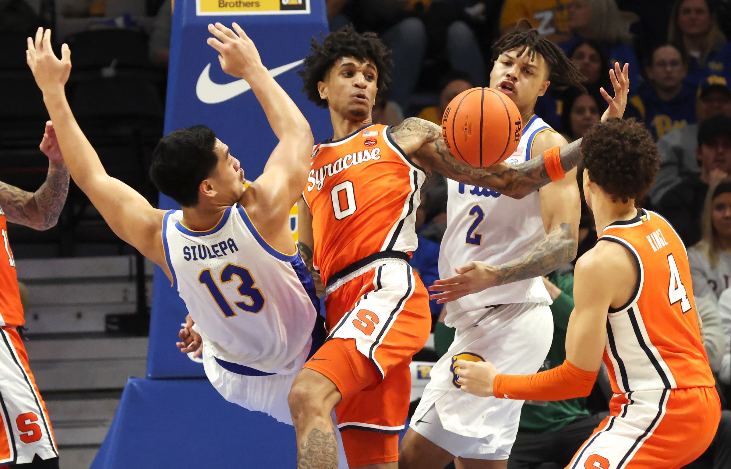 Jan 10, 2026; Pittsburgh, Pennsylvania, USA; Syracuse Orange forward Sadiq White Jr. (0) grabs a rebound ahead of Pittsburgh Panthers forward Roman Siulepa (13) and forward Cameron Corhen (2) during the second half at the Petersen Events Center. Mandatory Credit: Charles LeClaire-Imagn Images
