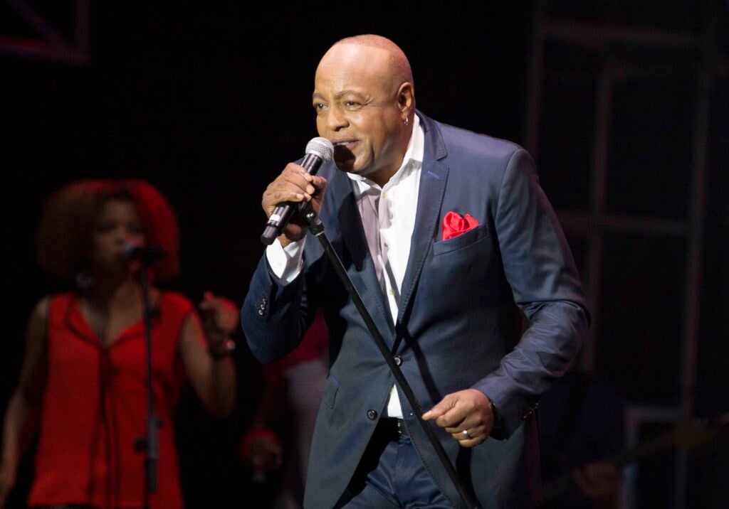 Peabo Bryson singing on stage