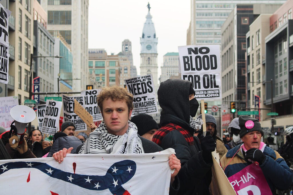 More than 100 people marched from Philadelphia City Hall to the U.S. Armed Forces recruitment center on Spring Garden Street