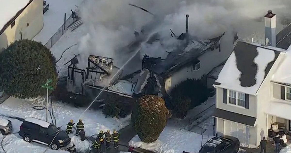 Somerton house fire: Fire crews search for man; neighbor rescues 85-year-old woman