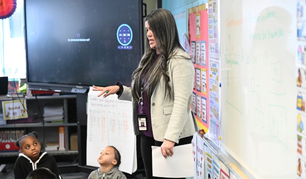 Ms. Munoz, a teacher at the Sonia Sotomayor Dual Language Academy, works with students in her classroom during a tour Thursday, Jan. 15, 2026, at the Allentown school sponsored by the American Federation of Teachers, the American Federation of Teachers Pennsylvania, the Allentown Federation of Paraprofessionals, the Labor Council for Latin American Advancement and the Allentown School District. State Rep. Peter Schweyer, D-Lehigh, was among those attending the event intended to highlight the contributions to the district by paraprofessionals and the local Latino community. (Amy Shortell/The Morning Call)