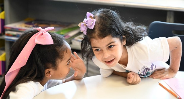 Sonia Sotomayor Dual Language Academy students Dayana, right, and Abigail, left, giggle as they do classwork in their second grade classroom during a tour Thursday, Jan. 15, 2026, at the Allentown school sponsored by the American Federation of Teachers, the American Federation of Teachers Pennsylvania, the Allentown Federation of Paraprofessionals, the Labor Council for Latin American Advancement and the Allentown School District. State Rep. Peter Schweyer, D-Lehigh, was among those attending the event intended to highlight the contributions to the district by paraprofessionals and the local Latino community. (Amy Shortell/The Morning Call)