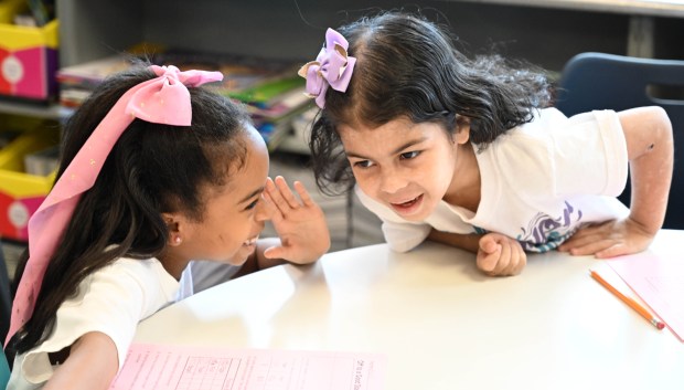 Sonia Sotomayor Dual Language Academy students Dayana, right, and Abigail, left, giggle as they do classwork in their second grade classroom during a tour Thursday, Jan. 15, 2026, at the Allentown school sponsored by the American Federation of Teachers, the American Federation of Teachers Pennsylvania, the Allentown Federation of Paraprofessionals, the Labor Council for Latin American Advancement and the Allentown School District. State Rep. Peter Schweyer, D-Lehigh, was among those attending the event intended to highlight the contributions to the district by paraprofessionals and the local Latino community. (Amy Shortell/The Morning Call)