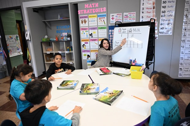 Miss Jarjous, a teacher at the Sonia Sotomayor Dual Language Academy, works with students in her classroom during a tour Thursday, Jan. 15, 2026, at the Allentown school sponsored by the American Federation of Teachers, the American Federation of Teachers Pennsylvania, the Allentown Federation of Paraprofessionals, the Labor Council for Latin American Advancement and the Allentown School District. State Rep. Peter Schweyer, D-Lehigh, was among those attending the event intended to highlight the contributions to the district by paraprofessionals and the local Latino community. (Amy Shortell/The Morning Call)