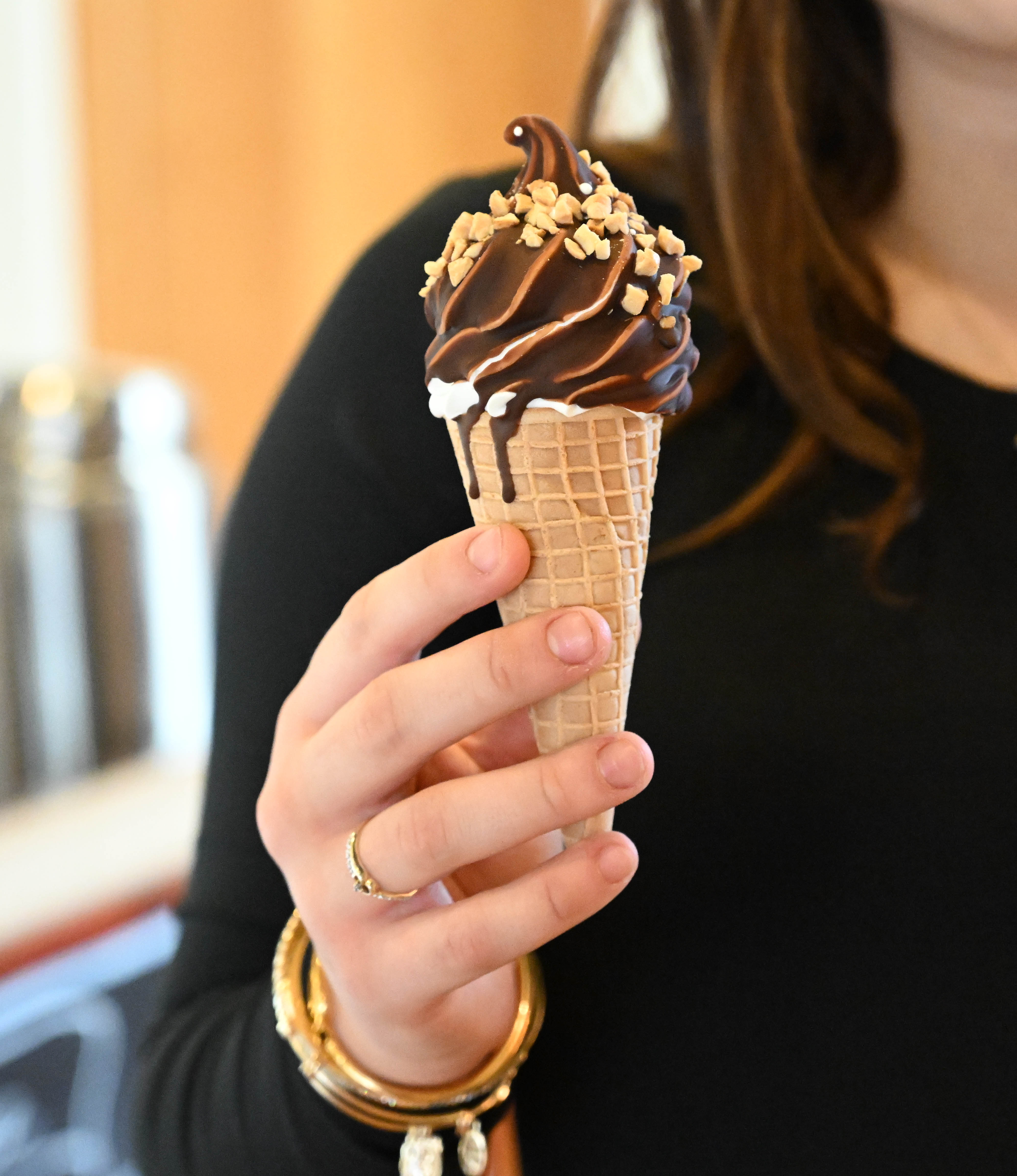 New Emily’s Ice Cream staff member Autumn Quercia holds an...