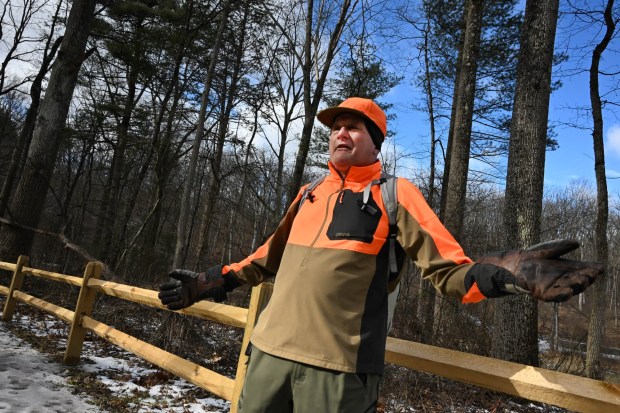Tim Schneider of Whitehall Township navigates melting ice Wednesday, Jan. 7, 2026, on the Henry's Woods Trail at Jacobsburg state park in Bushkill Township. Schneider says he came to check out the trail for a day trip with his wife and that it is a really nice location. The high temperature reached into the 50s Wednesday, well above the average 30 degrees on Jan. 7. (Amy Shortell/The Morning Call)