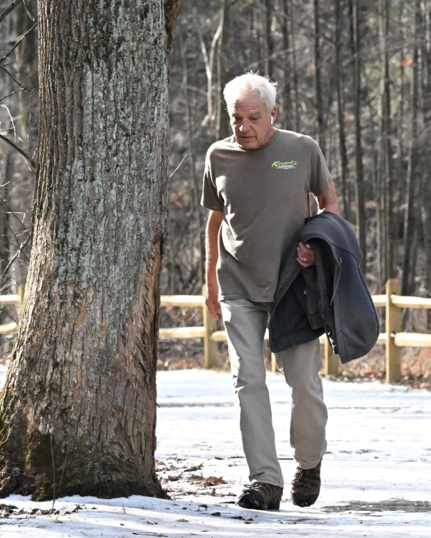 Joe Kardelis of Bushkill Township enjoys a walk Wednesday, Jan. 7, 2026, on the Henry's Woods Trail at Jacobsburg state park in Bushkill Township. Kardelis says he walks every day: " I can go out my backdoor and into the woods." The high temperature reached into the 50s Wednesday, well above the average 30 degrees on Jan. 7.(Amy Shortell/The Morning Call)