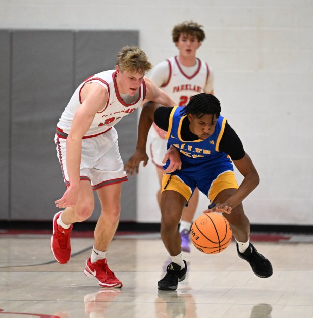 Players scramble for a loose ball  Tuesday, Jan. 20, 2026, during a game against Allen High School at Parkland High School. (Amy Shortell/The Morning Call)