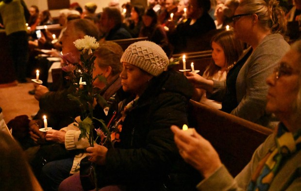 People attend a vigil for Renee Nicole Good, the woman shot and killed by a federal immigration agent in Minneapolis, on Friday, Jan. 9, 2026, at the Cathedral Church of the Nativity in Bethlehem. (Amy Shortell/The Morning Call)