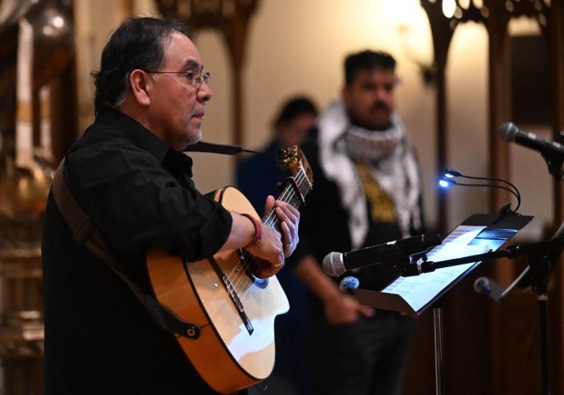Bernie Torres sings  during a vigil for Renee Nicole Good, the woman shot and killed by a federal immigration agent in Minneapolis, on Friday, Jan. 9, 2026, at the Cathedral Church of the Nativity in Bethlehem.(Amy Shortell/The Morning Call)
